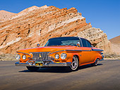 AUT 22 RK3189 01
1961 Plymouth Fury Orange Pearl 3/4 Front View On Pavement By Red Rock