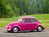 AUT 22 RK3195 01
1967 Volkswagen Bug Bright Pink 3/4 Side View On Dirt By Field And Pine Trees