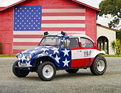 AUT 22 RK3200 01
1967 Volkswagen Baja American Flag 3/4 Side View On Gravel By Barn With American Flag