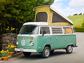 AUT 22 RK3203 01
1969 Volkswagen Westfalia Camper Green And White 3/4 Front View On Pavement By Yellow Flowers