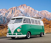 AUT 22 RK3238 01
1965 VW Standard Bus Green And White 3/4 Front View On Pavement Snowy Mountain Peaks