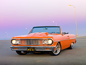 AUT 22 RK3255 01
1964 Chevrolet Chevelle Orange 3/4 Front View On Pavement By Street Lamps At Dusk