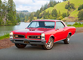 AUT 22 RK3263 01
1966 Pontiac GTO Red 3/4 Front View On Road By Lake And Trees