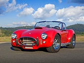 AUT 22 RK3285 01
1965 Cobra MK3 Roadster Red (Monza) 3/4 Front View On Pavement By Trees
