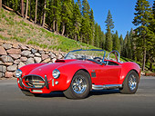 AUT 22 RK3286 01
1965 Cobra MK3 Roadster Red (Monza) 3/4 Front View On Pavement By Pine Trees