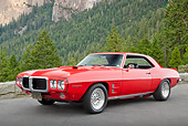 AUT 22 RK3313 01
1969 Pontiac Firebird Red 3/4 Front View On Pavement By Pine Trees