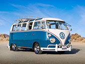 AUT 22 RK3318 01
1965 Volkswagen Deluxe Microbus Blue And White 3/4 Front View On Pavement By Sand And Rocks