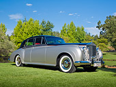 AUT 22 RK3330 01
1960 Rolls-Royce Silver Cloud II Radford Countryman Black And Silver 3/4 Front View On Grass By Trees
