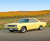 AUT 22 RK3354 01
1968 Plymouth Road Runner Yellow 3/4 Front View On Road By Vineyard
