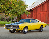 AUT 22 RK3360 01
1969 Dodge Charger Yellow And Black 3/4 Front View On Pavement By Red Barn