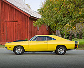 AUT 22 RK3366 01
1969 Dodge Charger Yellow And Black Profile View On Pavement By Red Barn