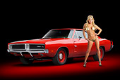 AUT 22 RK3369 01
1969 Dodge Charger R/T Hemi Bright Red 3/4 Front View In Studio With Swimsuit Model