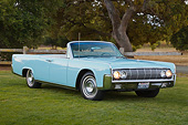 AUT 22 RK3415 01
1964 Lincoln Continental Convertible Baby Blue 3/4 Front View On Grass By Trees