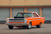 AUT 22 RK3419 01
1966 Plymouth Belvedere II Orange 3/4 Front View On Pavement By Building