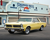 AUT 22 RK3421 01
1965 Pontiac GTO Yellow 3/4 Front View On Pavement By Restaurant