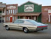 AUT 22 RK3426 01
1966 Dodge Hemi Charger Silver Gray 3/4 Rear View On Pavement By Buildings