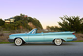AUT 22 RK3439 01
1960 Chrysler New Yorker Convertible Turquoise Profile View On Pavement By Grass At Dusk