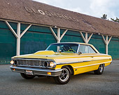 AUT 22 RK3447 01
1964 Ford Galaxie 500 XL Factory Lightweight Banana Yellow Pearl 3/4 Front View On Pavement By Blue Barn