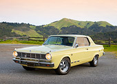 AUT 22 RK3451 01
1965 Dodge Dart Charger Yellow 3/4 Front View On Pavement By Grassy Hills