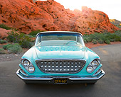 AUT 22 RK3454 01
1962 Chrysler Newport Turquoise Front View On Pavement By Red Rock