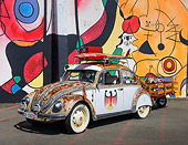 AUT 22 RK3460 01
1969 Volkswagen Beetle White And Rusty 3/4 Front View On Pavement By Mural
