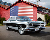 AUT 22 RK3468 01
1967 Ford Fairlane 500 Silver And Black 3/4 Front View On Pavement By Building With American Flag