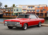 AUT 22 RK3469 01
Buick GS Red With Black Vinyl Roof 3/4 Front View On Pavement By Canal And Buildings