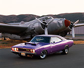 AUT 22 RK0021 02
1968 Dodge Charger Purple Side 3/4 View On Pavement By Airplane