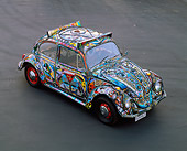 AUT 22 RK0113 04
1969 Volkswagen Beetle Covered In Marbles And Stained Glass Overhead 3/4 Front View On Pavement