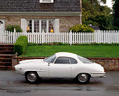 AUT 22 RK0164 02
1966 Alfa Romeo Sprint Speciale White Profile On Pavement By House