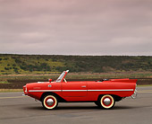 AUT 22 RK0184 02
1964 Amphicar Convertible Red Profile View On Pavement Gray Clouds