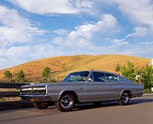 AUT 22 RK0188 04
1966 Dodge Charger 426 Hemi Silver Low 3/4 Side View On Pavement Dry Grass Hills
