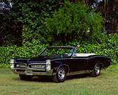 AUT 22 RK0218 06
1967 Pontiac GTO Convertible Black 3/4 Front View On Grass Trees Background
