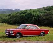 AUT 22 RK0223 01
1962 Chevrolet Corvair Monza Spyder Red 3/4 Side View On Grass