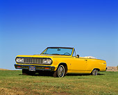 AUT 22 RK0233 01
1964 Chevrolet Chevelle Malibu Convertible Yellow 3/4 Front View On Grass Hill
