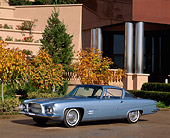 AUT 22 RK0294 01
1962 Dual Ghia Coupe Light Blue 3/4 Side View On Pavement By Trees