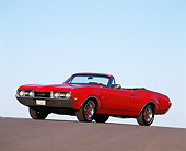 AUT 22 RK0301 03
1968 442 Oldsmobile Convertible Red Low 3/4 Side View On Pavement Hill