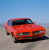 AUT 22 RK0325 02
1969 Pontiac GTO Convertible The Judge Red Front 3/4 View On Pavement Hill Blue Sky