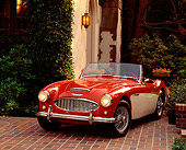 AUT 22 RK0338 02
1960 Austin-Healey 3000 Mark 1 BN-7 Red And White 3/4 Front View On Pavement By Trees And Bushes