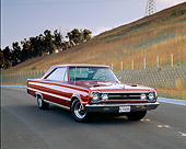 AUT 22 RK0447 04
1967 Plymouth GTX 426 Hemi Turbine Bronze 3/4 Front View On Pavement By Dry Grass Hill
