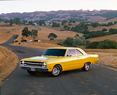 AUT 22 RK0470 02
1969 Dodge 340 Dart Swinger Yellow 3/4 Side View On Pavement Dry Grass Hills