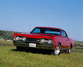 AUT 22 RK0488 04
1967 Oldsmobile Cutlass 442 Red 3/4 Front View On Grass