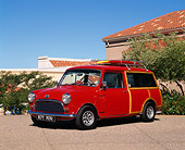 AUT 22 RK0490 07
1964 Austin Mini Countryman Red 3/4 Front View On Pavement By Trees Blue Sky