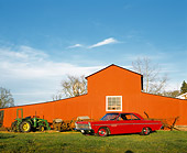 AUT 22 RK0990 02
1965 Plymouth Sports Fury Red 3/4 Side View On Grass By Barn Blue Sky