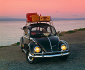 AUT 22 RK1060 05
1960 VW Beetle Black With Roof Rack 3/4 Front View On Pavement By Water Filtered