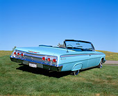 AUT 22 RK1080 02
1962 Chevy Impala Light Blue 3/4 Rear View On Grass Blue Sky