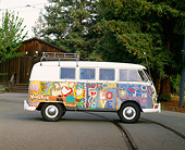 AUT 22 RK1089 07
1965 VW Kombi Hippie Bus Profile Shot On Pavement By Trees