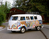 AUT 22 RK1091 01
1965 VW Kombi Hippie Bus 3/4 Side View On Pavement By Trees