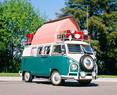 AUT 22 RK1096 09
1967 VW Dormobile Camper Bus Green And White Low 3/4 Side View On Pavement By Trees