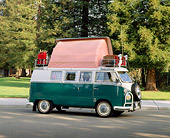 AUT 22 RK1097 01
1967 Volkswagen Dormobile Camper Bus Green And White 3/4 Front View On Pavement By Grass And Trees